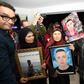 Tunisian mothers of torture victims carry their sons' portraits at the The Truth and Dignity Commission in Tunis