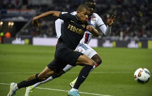 Monaco's forward Kylian Mbappe Lottin (L) clashes with Lyon's defender Mouctar Diakhaby on April 23, 2017
