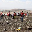 Red Cross officials recover bodies form the scene of the Ethiopian Airlines ET 302 plane crash (Twitter)