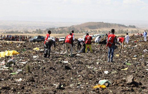 Red Cross officials recover bodies form the scene of the Ethiopian Airlines ET 302 plane crash (Twitter)