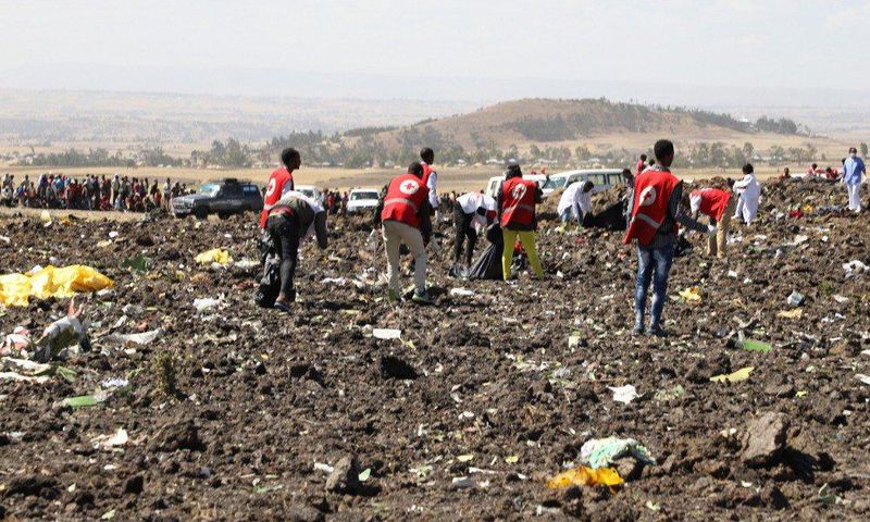 Red Cross officials recover bodies form the scene of the Ethiopian Airlines ET 302 plane crash (Twitter)