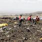 Red Cross officials recover bodies form the scene of the Ethiopian Airlines ET 302 plane crash (Twitter)
