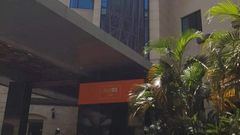 Banner draped over Dusit D2 Hotel after the facility was closed following a terror attack (Twitter)