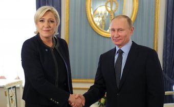 Russian president, Vladmir Putin  shakes hands with French presidential candidate, Marine Le Pen.