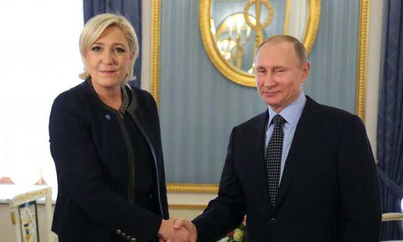 Russian president, Vladmir Putin  shakes hands with French presidential candidate, Marine Le Pen.