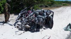 The mangled wreckage of the TGF car after it was blown up by a past IED.