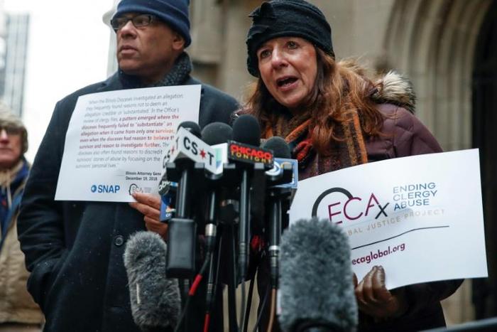 Patricia Gallagher Marchant (R), a victim of clergy abuse, speaks outside the Archdiocese of Chicago