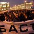 People carry a banner reading 'Stop' during a rally called the "March of Infuriated Belarusians" against a Soviet-style "tax on spongers" in Minsk, on February 17, 2017