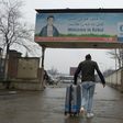 An Afghan refugee who was deported from Germany arrives with his belongings at Kabul airport on January 24, 2017