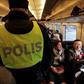 Swedish police carry out identity checks on the train from Copenhagen, Denmark, to Malmo, Sweden, on November 12, 2015