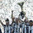 Juventus' players celebrate with the trophy after winning the "Scudetto" at the Juventus Stadium in Turin on May 21, 2017