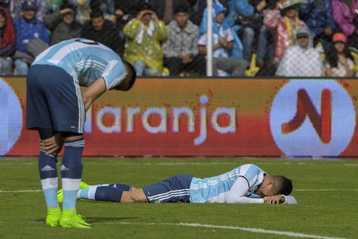 Argentina's Marcos Rojo (R) and Mateo Musacchio react during their 2018 FIFA World Cup qualifier football match in La Paz, on March 28, 2017
