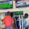 Kenyans place their bets at one of the many betting spots in Nairobi on July 30, 2016, along Market Street.
