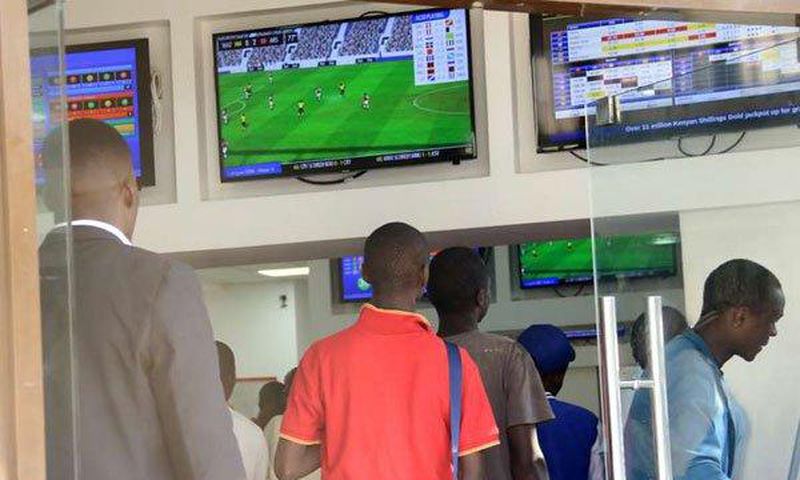 Kenyans place their bets at one of the many betting spots in Nairobi on July 30, 2016, along Market Street.