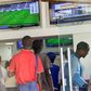 Kenyans place their bets at one of the many betting spots in Nairobi on July 30, 2016, along Market Street.