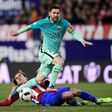 Barcelona's forward Lionel Messi (top) vies with Atletico Madrid's forward Antoine Griezmann during the Spanish Copa del Rey semi final first leg football match February 1, 2017