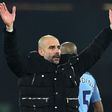 Manchester City's manager Pep Guardiola celebrates on the pitch after the English Premier League football match between Bournemouth and Manchester City at the Vitality Stadium in Bournemouth, southern England on February 13, 2017
