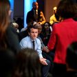 French presidential candidate Emmanuel Macron listens to people during a campaign rally in the tough Paris suburb of Saint-Denis