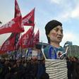 Protesters carry an effigy of South Korea's President Park Geun-Hye during an anti-government rally demanding the resignation of the president in central Seoul