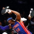 Tobias Harris of the Detroit Pistons and Trevor Booker of the Brooklyn Nets collide going for the ball during the game October 6, 2016 in New York City