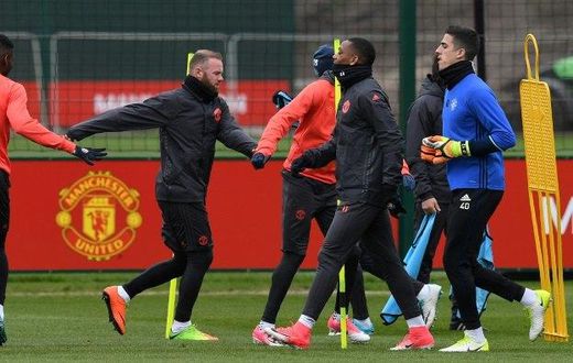 Manchester United's English striker Wayne Rooney (C) takes part in a team training session at their Carrington base in Manchester, April 12, 2017, on the eve of their UEFA Europa League quarter-final football match against Anderlecht