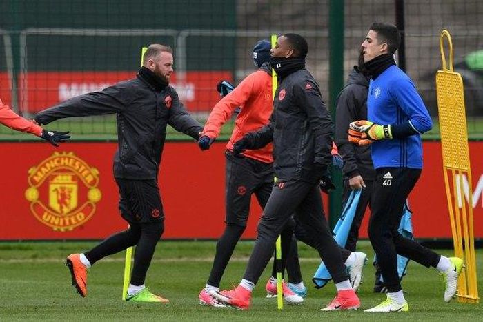 Manchester United's English striker Wayne Rooney (C) takes part in a team training session at their Carrington base in Manchester, April 12, 2017, on the eve of their UEFA Europa League quarter-final football match against Anderlecht