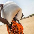A woman carries a sack of food distributed in Ganyiel, Panyijiar county, in South Sudan