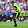 Huddersfield Town's German defender Christopher Schindler scores the final penalty in the shoot-out during the English Championship play-off final football match between Huddersfield Town and Reading at Wembley Stadium in London on May 29, 2017