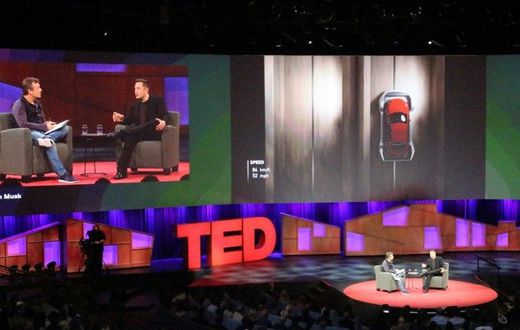 Elon Musk went teased the audience with a photo of a self-driving truck that his company Tesla Motors is adding to its line of electric cars