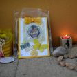 Candles and a photograph of Madeleine McCann are placed outside the church in Praia da Luz on May 3, 2017 to mark 10 years since the British girl's mysterious disappearance in the Portuguese seaside village