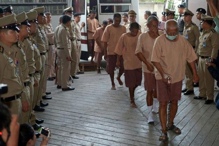 Some of the dozens of people arrested in a crackdown on human trafficking arrive in court to present their defence