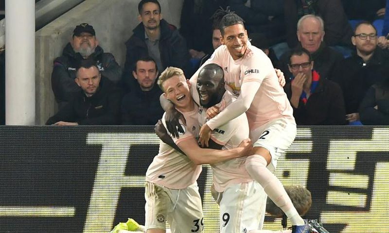 Manchester United striker Romelu Lukaku (centre) celebrates his second goal against Crystal Palace