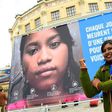 Radha Rani Sarker, who escaped forced marriage at the age of 14 in Bangladesh, pictured in front of NGO Plan International's campaign poster in Paris on the eve of the UN International Day of the Girl Child, on October 10, 2016