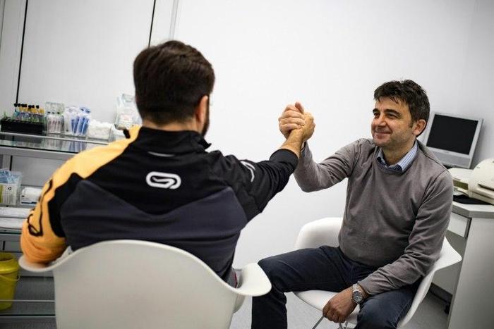 An anonymous Italian patient (L) shaked hands with Serbian Professor Miroslav Djordjevic, after his sex change operations at a specialised clinic in Belgrade