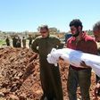 Syrians bury the bodies of victims of a a suspected chemical attack in Khan Sheikhun, a rebel-held town in Syria’s northwestern Idlib province, on April 5, 2017