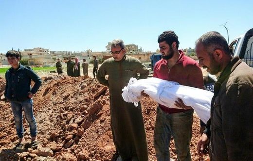 Syrians bury the bodies of victims of a a suspected chemical attack in Khan Sheikhun, a rebel-held town in Syria’s northwestern Idlib province, on April 5, 2017