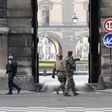 Police and soldiers patrol outside the Louvre on February 3, 2017 in Paris