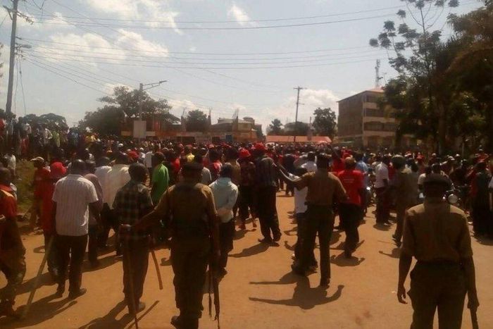 Armed police officers separate supporters of Kenneth Lusaka and Wycliffe Wangamati when they clashed in Bungoma town, June 2, 2017.