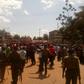 Armed police officers separate supporters of Kenneth Lusaka and Wycliffe Wangamati when they clashed in Bungoma town, June 2, 2017.