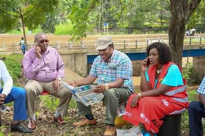 Kabete MP Ferdinand Waititu (reading newspaper), Thika Town MP Alice Nganga (right).