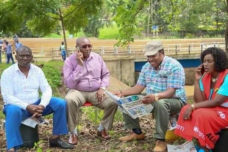 Kabete MP Ferdinand Waititu (reading newspaper), Thika Town MP Alice Nganga (right).