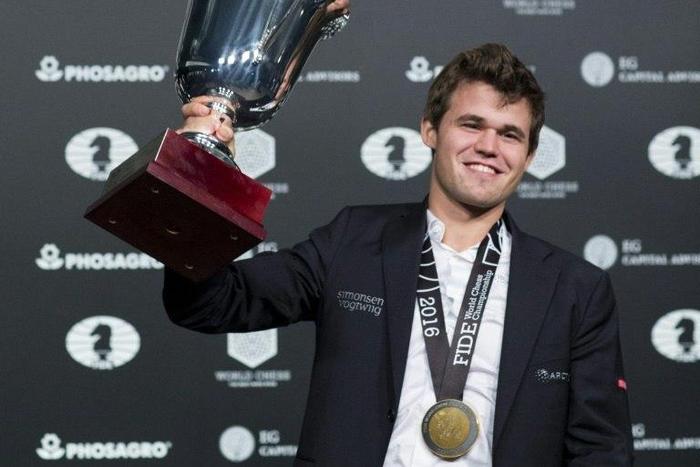 Norwegian world chess champion Magnus Carlsen beat Russia's Sergei Karyakin on his 26th birthday to win his third straight world championship