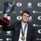 Norwegian world chess champion Magnus Carlsen beat Russia's Sergei Karyakin on his 26th birthday to win his third straight world championship