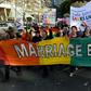 Gay marriage supporters march during a rally in Sydney on June 25, 2016