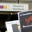 A member of Belgium's Muslim Community holds a sign reading 'Terrorism has no religion' as people take part in a tribute to the victims of March 22 Brussels terror attacks, on April 9, 2016, outside of the Maelbeek/Maalbeek metro station