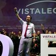 Pablo Iglesias (L), leader of left-wing party Podemos, raises his fist during the second day of the party congress at Vistalegre bullring in Madrid on February 12, 2017 that saw him re-elected as general secretary