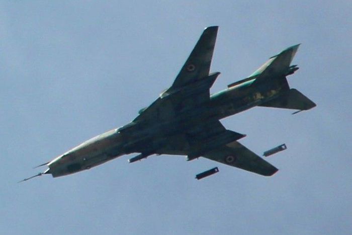 A Syrian Sukhoi SU-17 drops bombs over Jobar district on the eastern outskirts of Damascus on March 20, 2017
