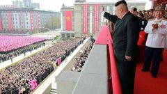 An official Korean Central News Agency image shows leader Kim Jong-Un waving to people after the military parade in Pyongyang on on April 16, 2017