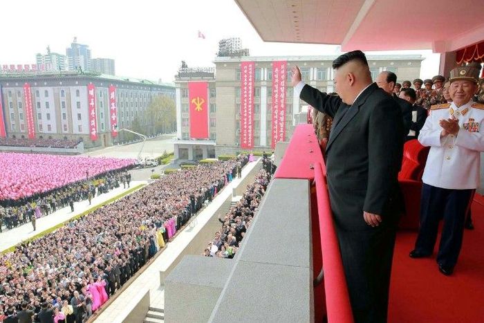 An official Korean Central News Agency image shows leader Kim Jong-Un waving to people after the military parade in Pyongyang on on April 16, 2017