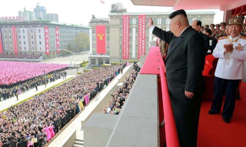 An official Korean Central News Agency image shows leader Kim Jong-Un waving to people after the military parade in Pyongyang on on April 16, 2017